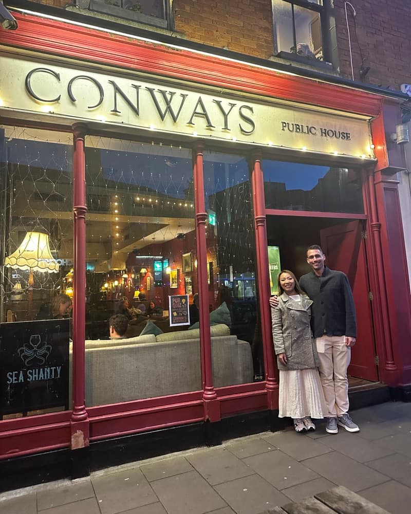 Anna and Matt in the same doorway of Conways, Dublin, in March 2026.