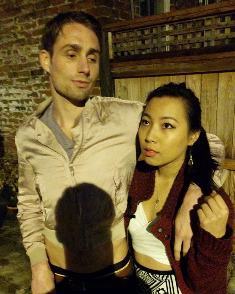 Matt and Anna posing together outside at night in Richmond.